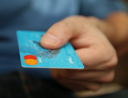 Man Handing A Credit Card