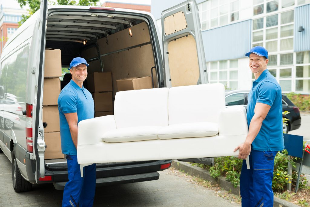 Man Moving A Couch In Denver