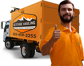 Altitude Hauling Crew Member Giving Thumbs Up In Front Of Truck