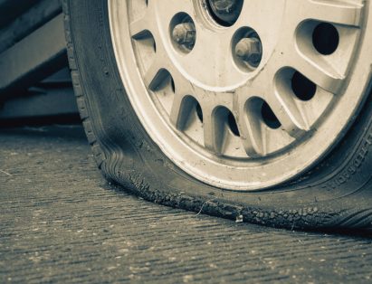 flat tire close-up dirty road